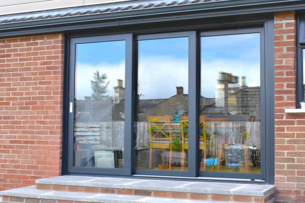 Triple track patio door in grey