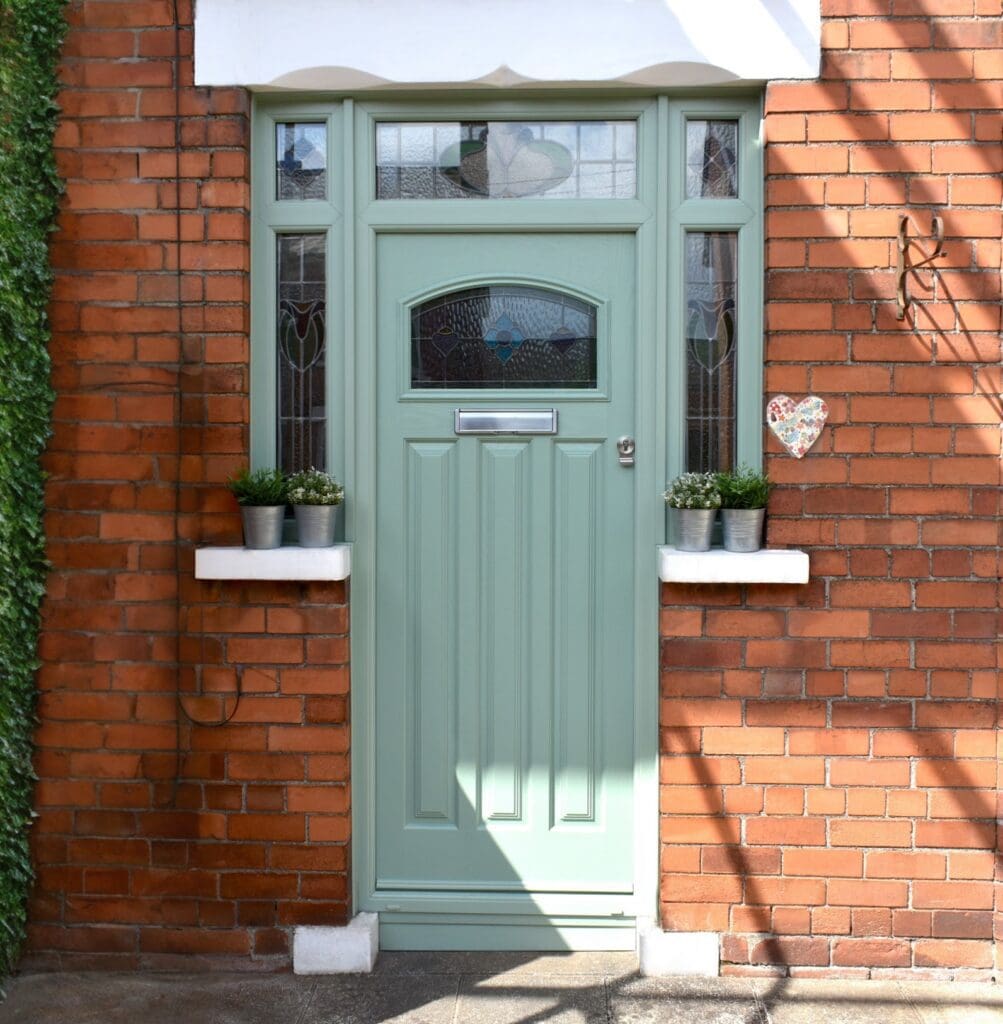 A new chartwell green composite front door with lead light retention - stained glass